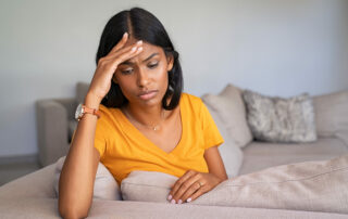 A stressed woman looking for natural remedies for anxiety.